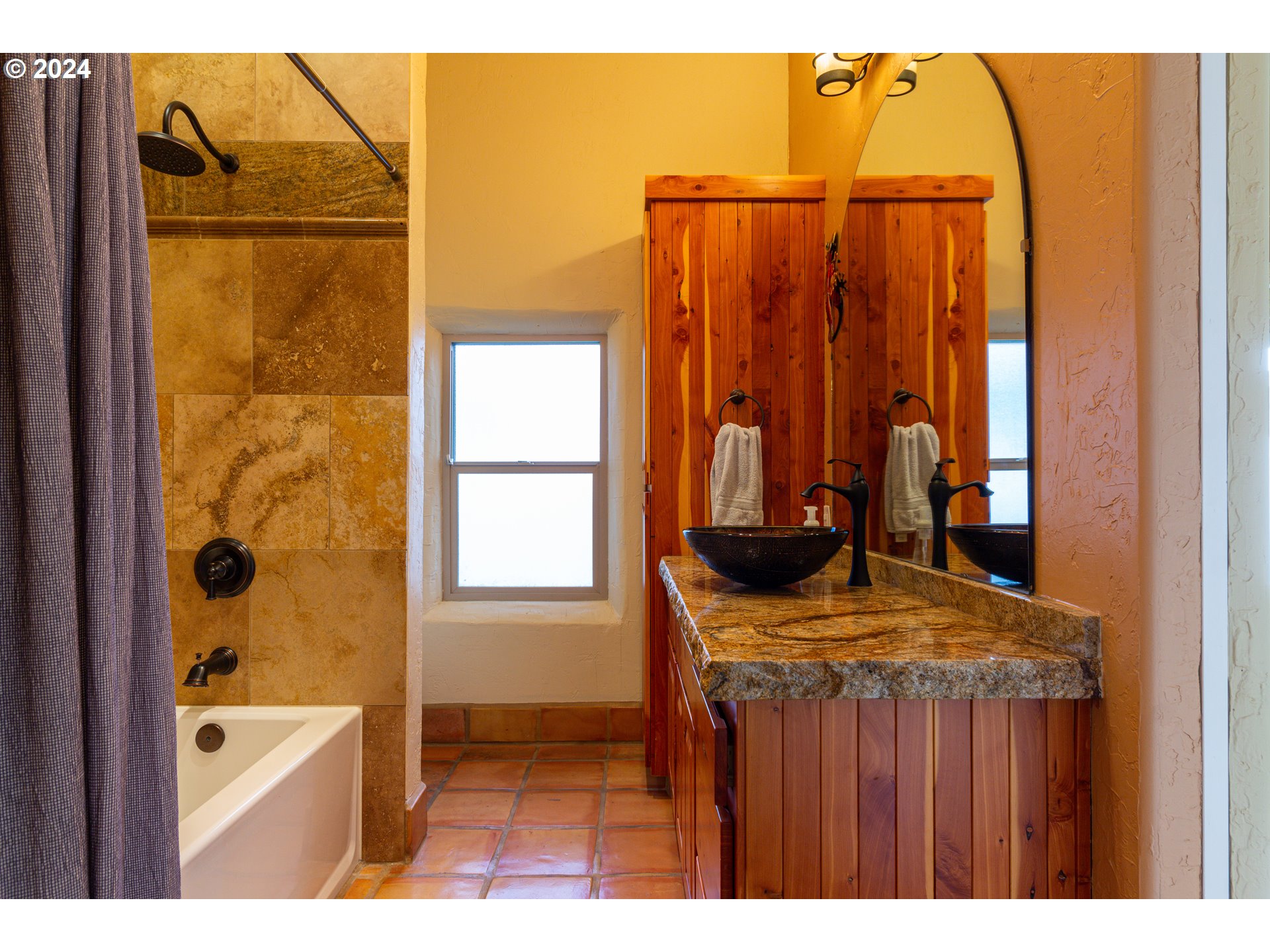 832 East Main Street Hermiston, OR 97838 - Photo 22 of 48 a bathroom with a granite countertop sink a mirror and shower