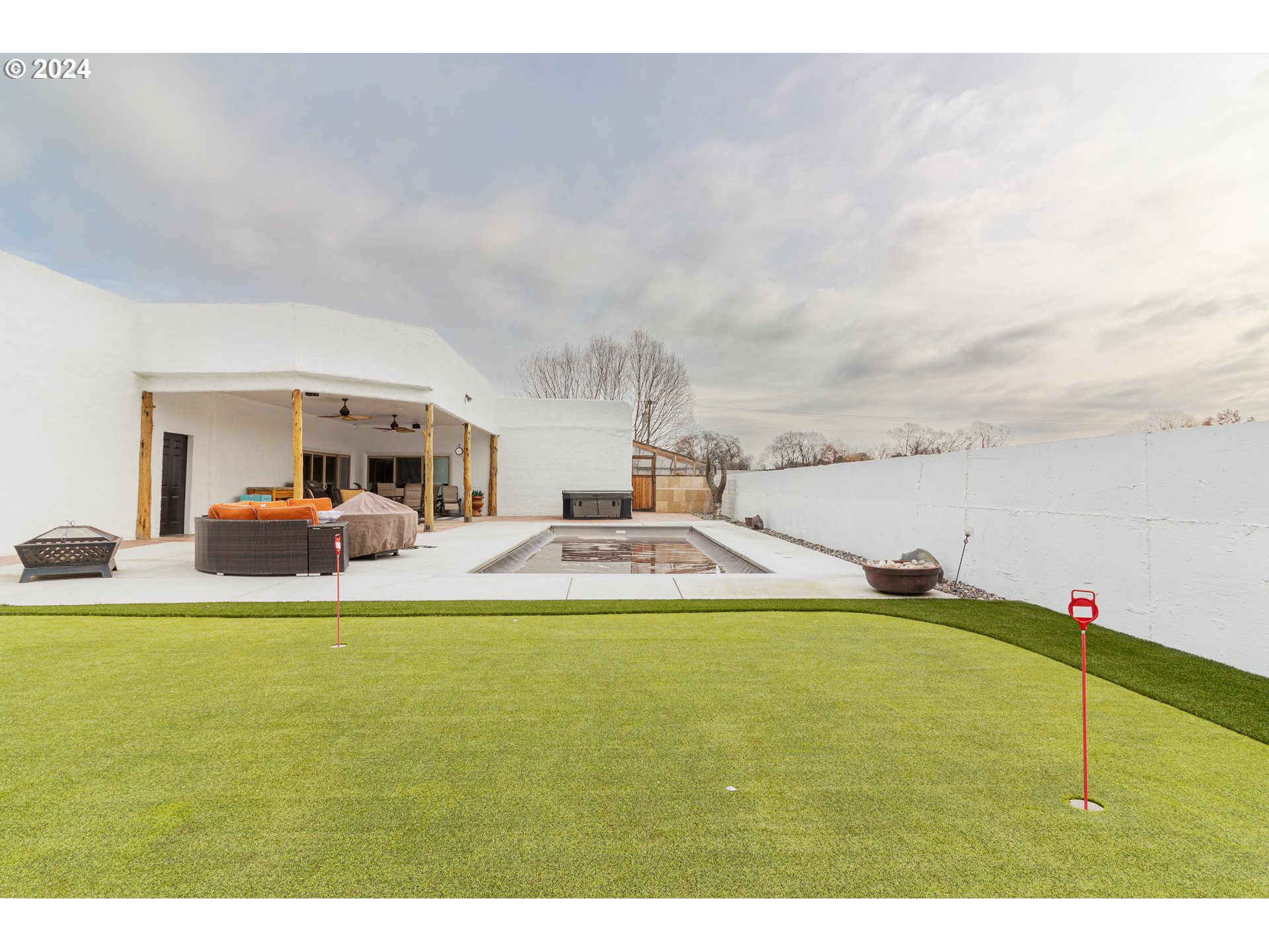 832 East Main Street Hermiston, OR 97838 - Photo 26 of 48 a view of a swimming pool and an outdoor seating