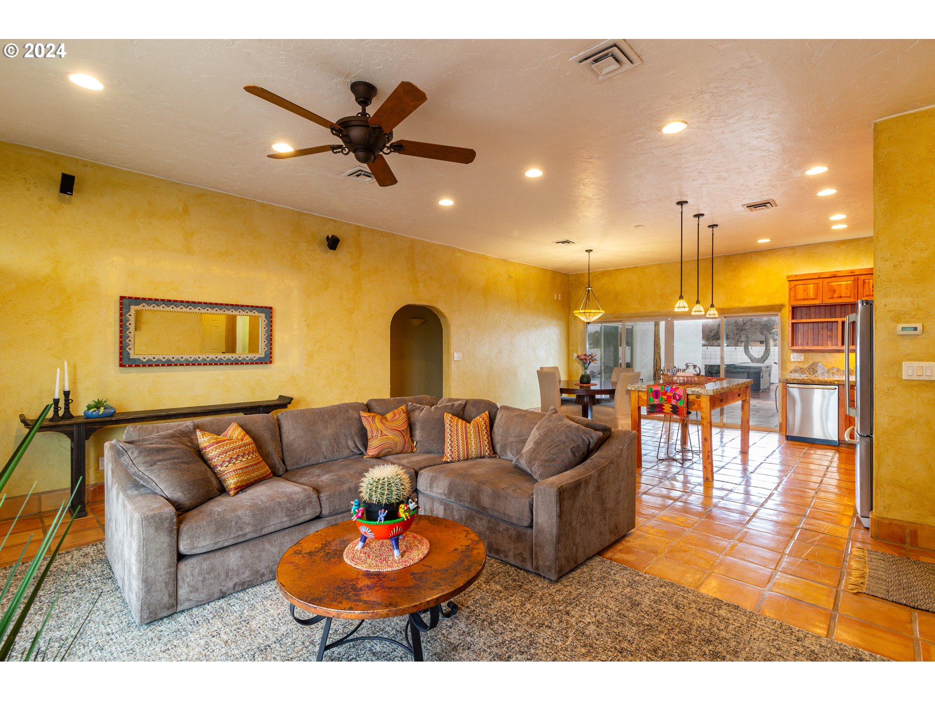 832 East Main Street Hermiston, OR 97838 - Photo 7 of 48 a living room with furniture kitchen view and a chandelier