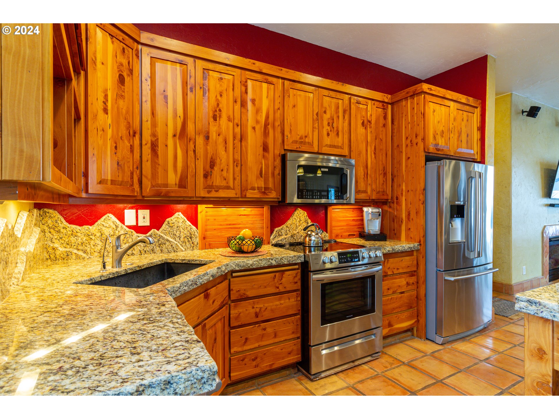 832 East Main Street Hermiston, OR 97838 - Photo 10 of 48 a kitchen with stainless steel appliances granite countertop a refrigerator and a stove