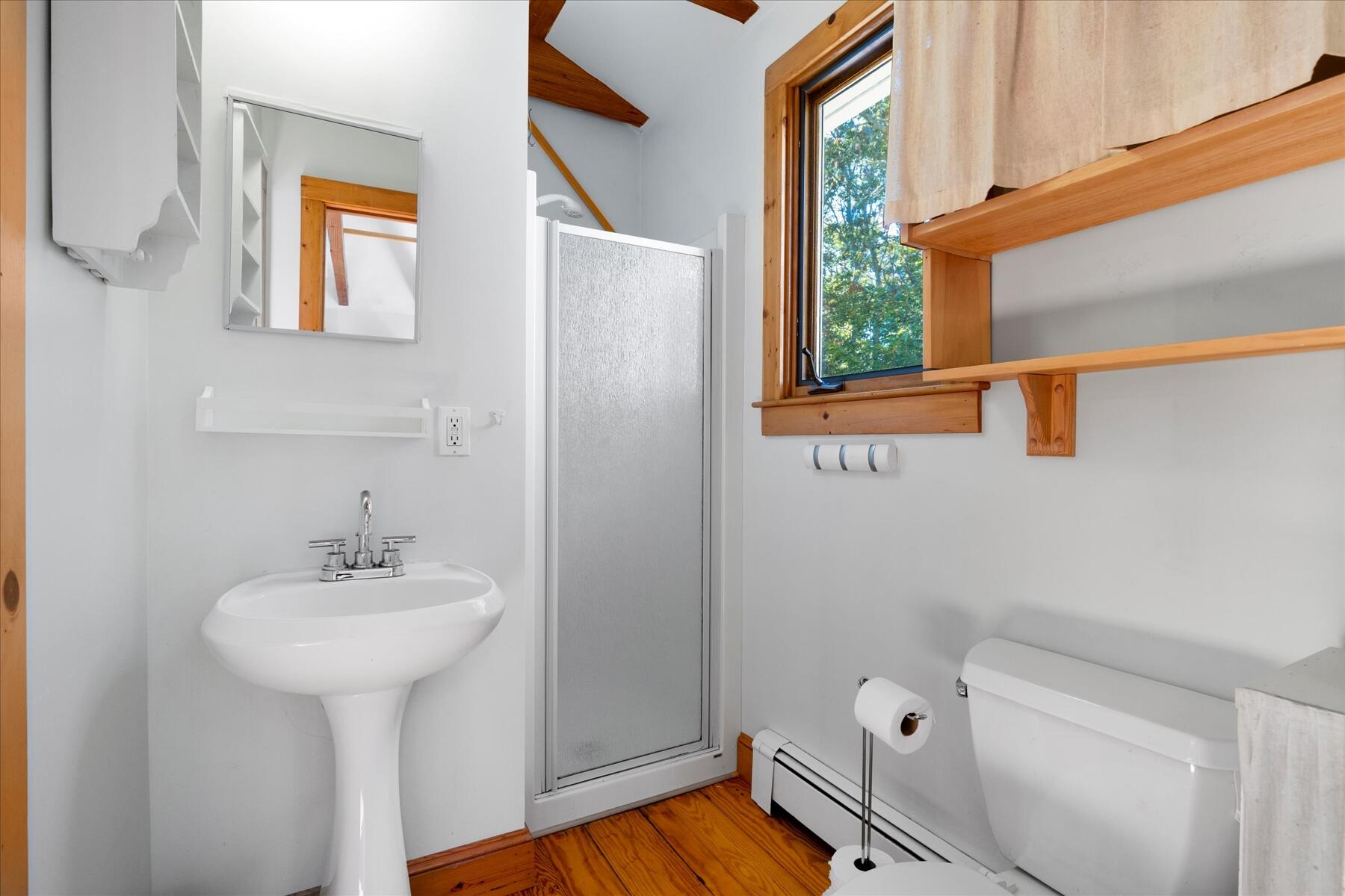 152 Wakeby Road Marstons Mills, MA 02648 - Photo 14 of 27 a bathroom with a sink a mirror and a toilet
