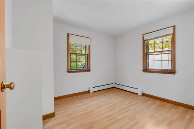 a swimming pool with trees in the background