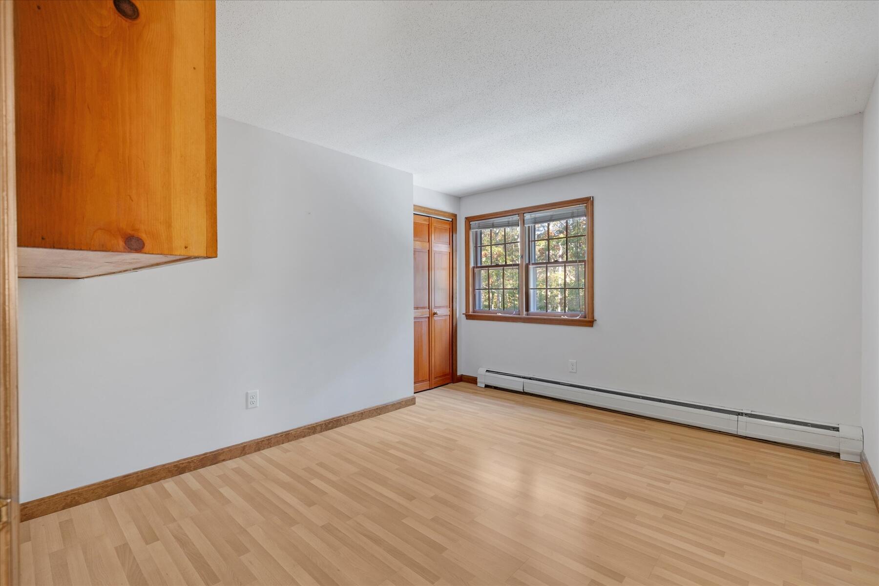 152 Wakeby Road Marstons Mills, MA 02648 - Photo 20 of 27 an empty room with windows