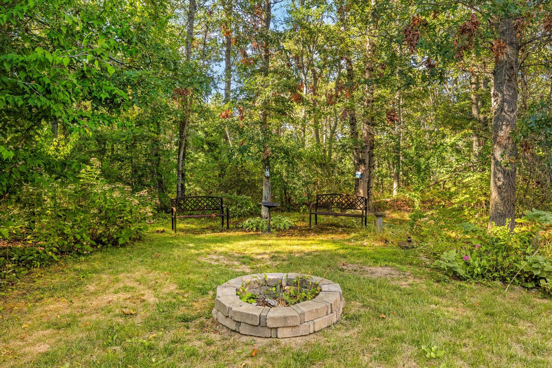 152 Wakeby Road Marstons Mills, MA 02648 - Photo 24 of 27 a swimming pool with trees in the background