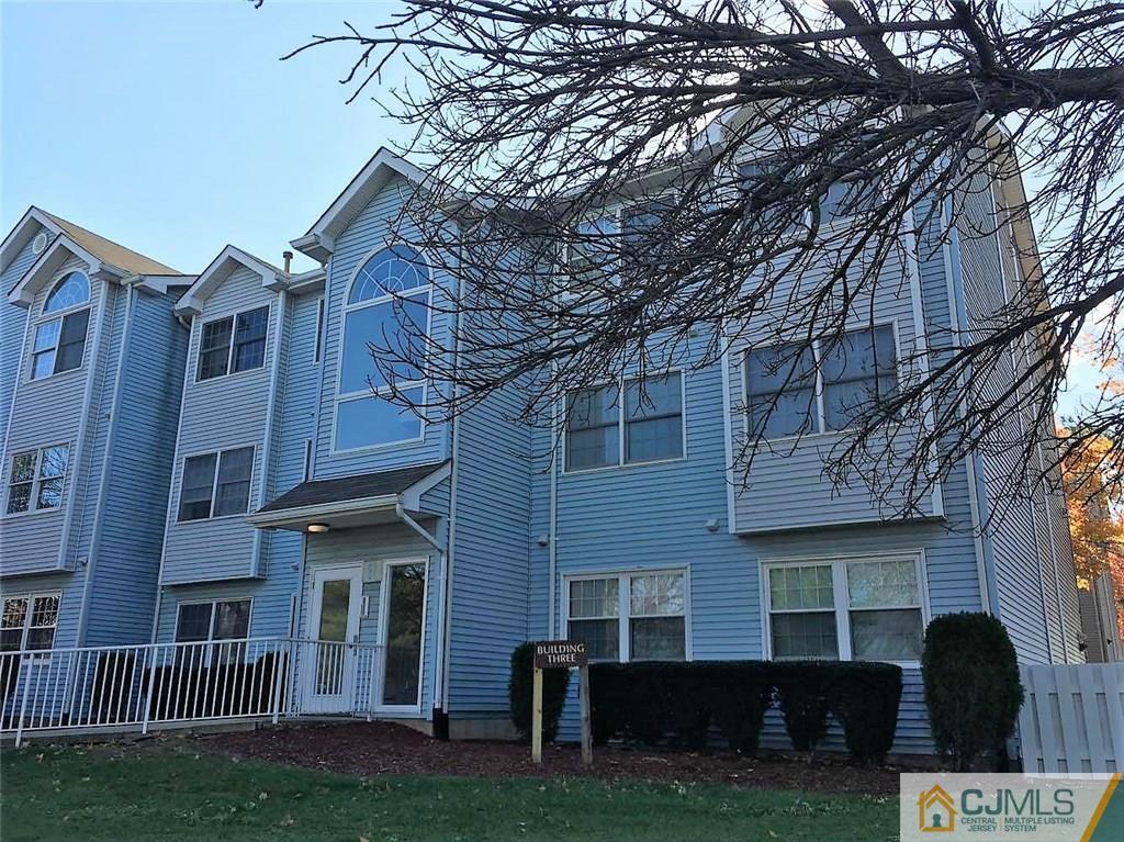 321 Edpas Road, Unit 321 New Brunswick, NJ 08901 - Photo 3 of 17 a front view of a house with a yard