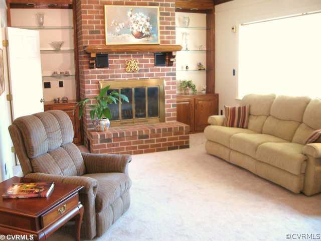 5841 Deep Forest Road Chester, VA 23831 - Photo 6 of 12 a living room with furniture and a fireplace