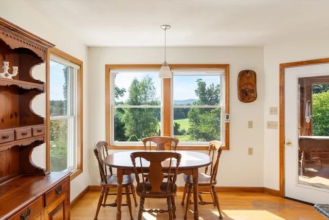 a view of a dining room with furniture window and outside view