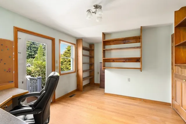 a bathroom with a sink a toilet and shower curtain