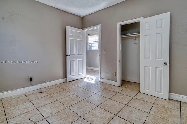 a view of a livingroom with an empty space and window