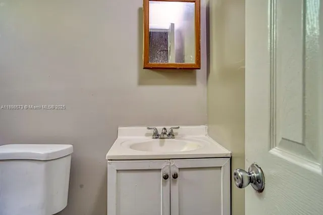 a view of a hallway with a bathroom