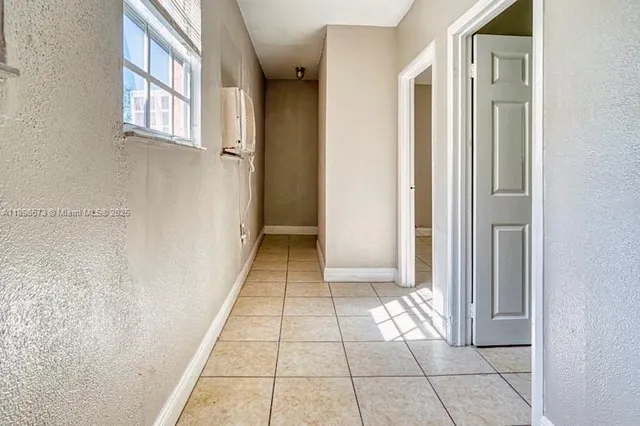 a view of a utility room with closet