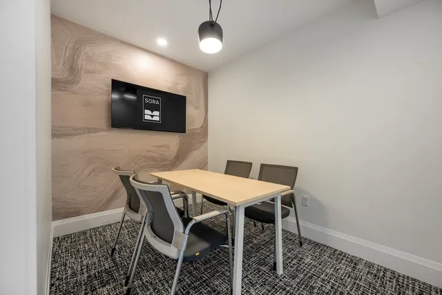 a view of a dining room with furniture
