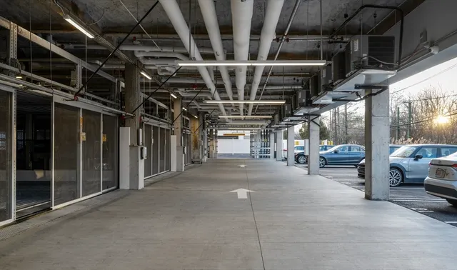 a view of parking garage with cars