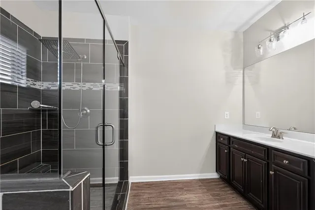 a bathroom with a double vanity sink and a mirror