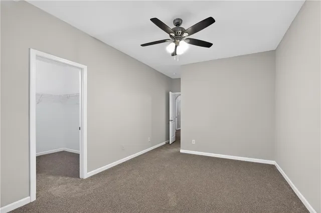 an empty room with a view of a hallway