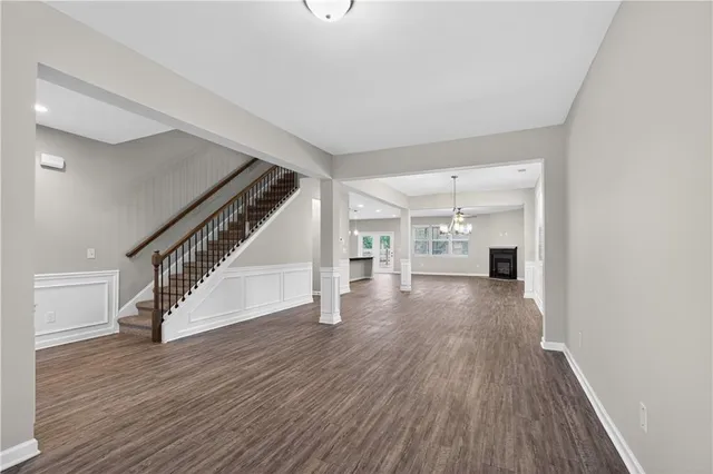 a view of entryway and hall with wooden floor