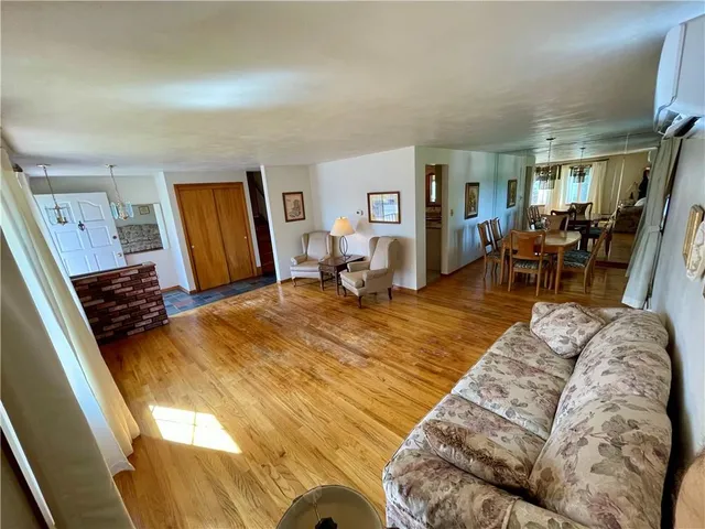 a bed room with a bed and a chair