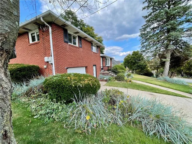a aerial view of a house with a yard