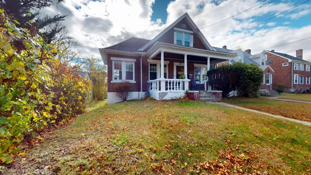 a front view of house with an outdoor space and seating