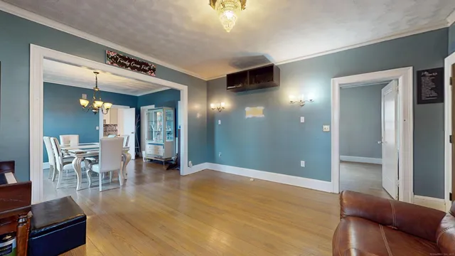 a view of a livingroom with furniture and a ceiling fan