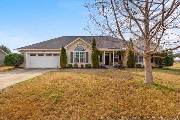 front view of a house with a yard