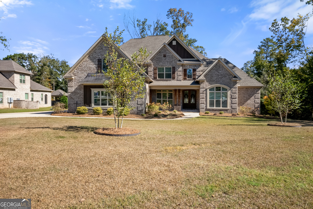 a front view of a building with a yard