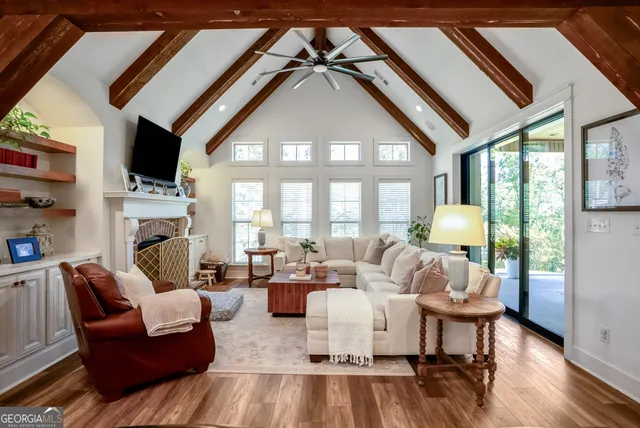 a living room with furniture fireplace and a flat screen tv
