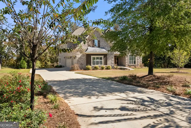 a front view of a house with a yard