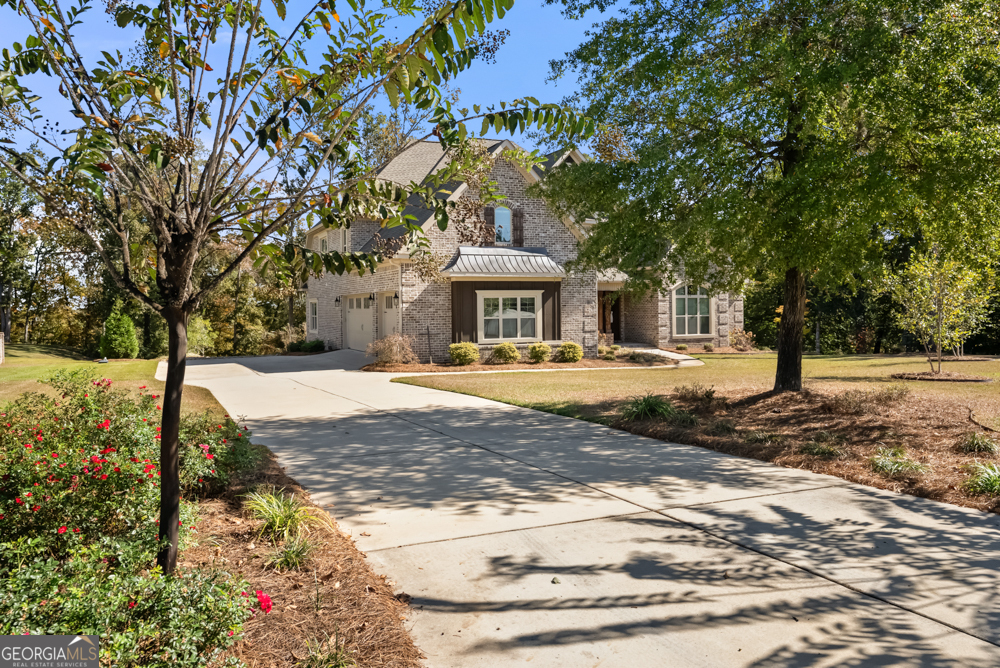 206 Altamaha Way Bonaire, GA 31005 - Photo 2 of 51 a front view of a house with a yard