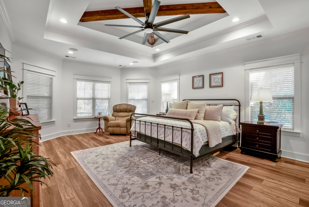 206 Altamaha Way Bonaire, GA 31005 - Photo 27 of 51 a spacious bedroom with a bed and balcony view