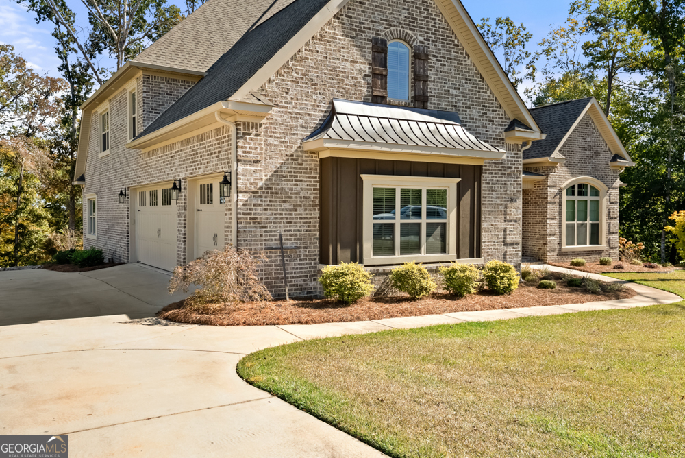 206 Altamaha Way Bonaire, GA 31005 - Photo 3 of 51 a front view of a house with a yard
