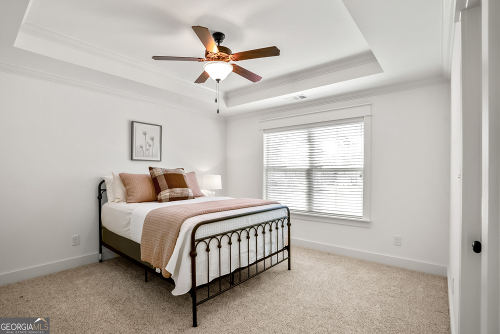 206 Altamaha Way Bonaire, GA 31005 - Photo 35 of 51 a spacious bedroom with a bed and window