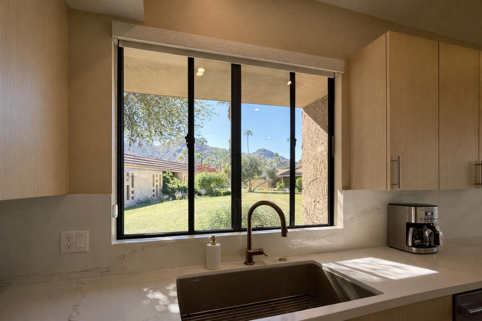 45565 Pima Road Indian Wells, CA 92210 - Photo 14 of 30 a kitchen with a sink and a window