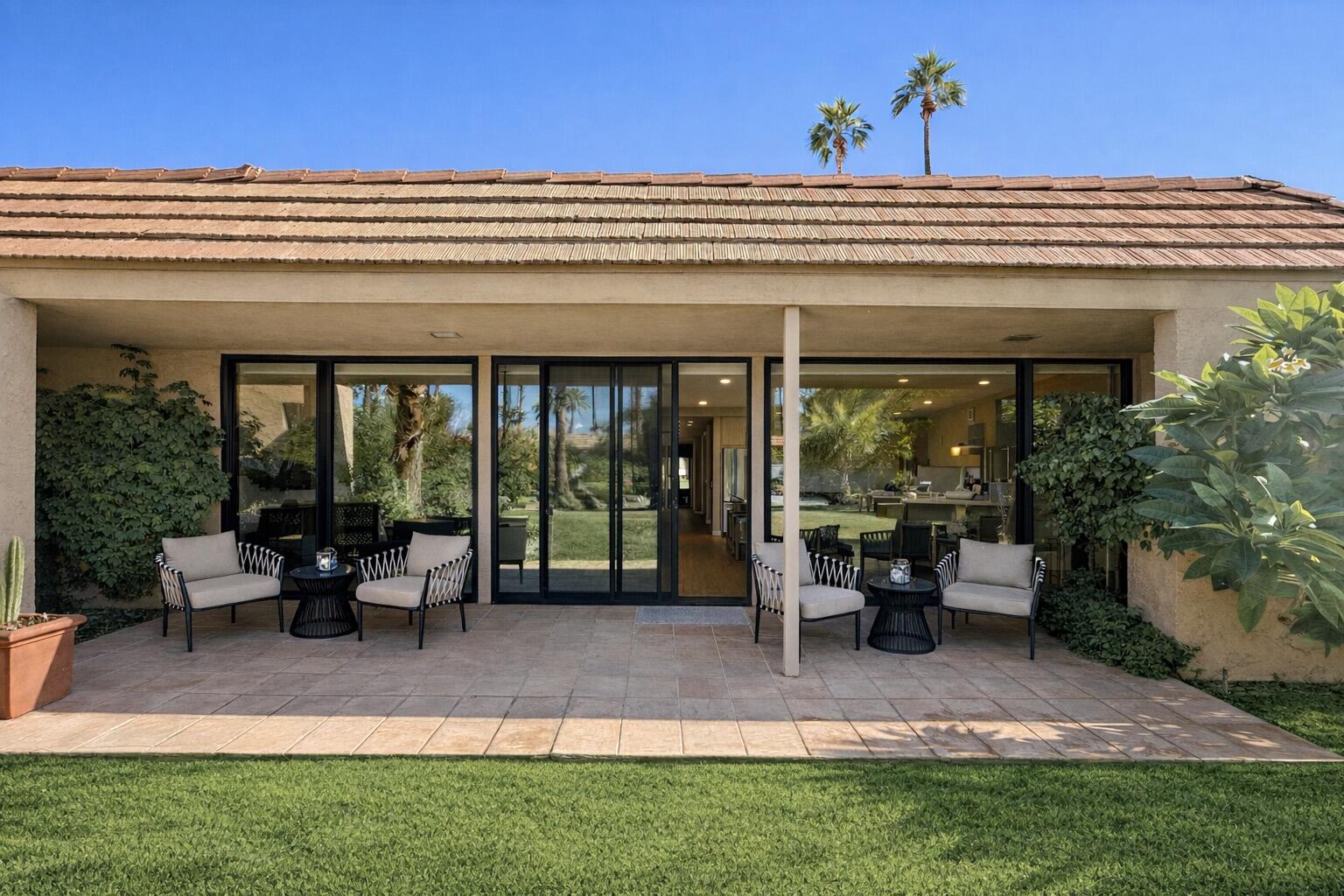 45565 Pima Road Indian Wells, CA 92210 - Photo 15 of 30 a view of a building with sitting area and garden