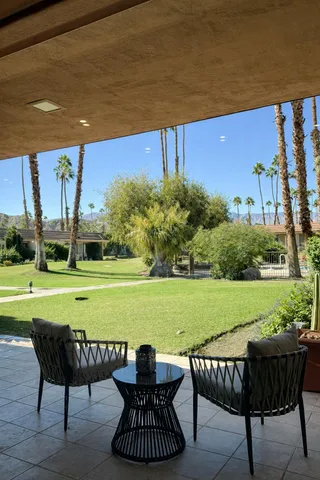 a view of a chairs and table on the patio