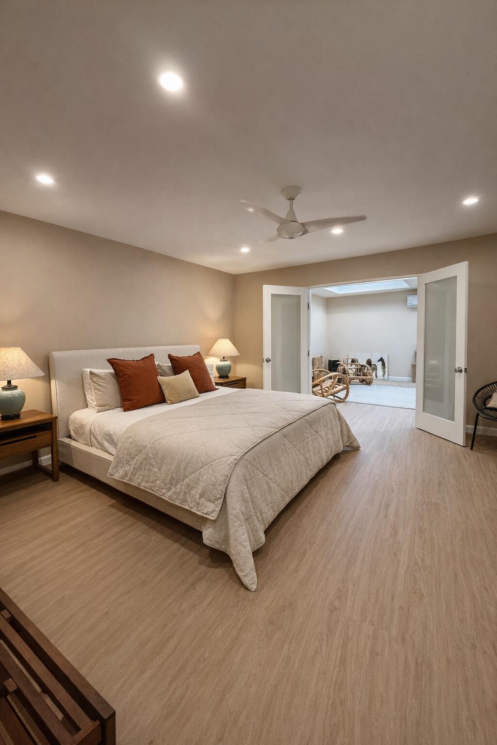 45565 Pima Road Indian Wells, CA 92210 - Photo 20 of 30 a spacious bedroom with a bed and a view of kitchen