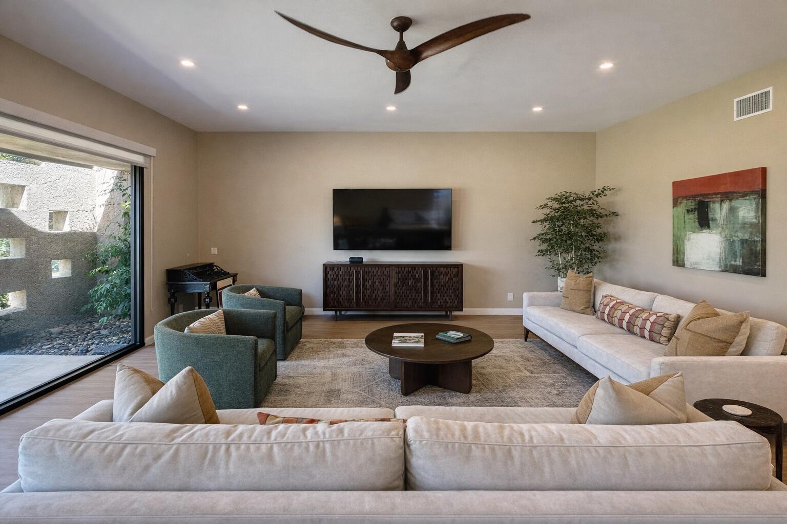45565 Pima Road Indian Wells, CA 92210 - Photo 2 of 30 a living room with furniture and a flat screen tv