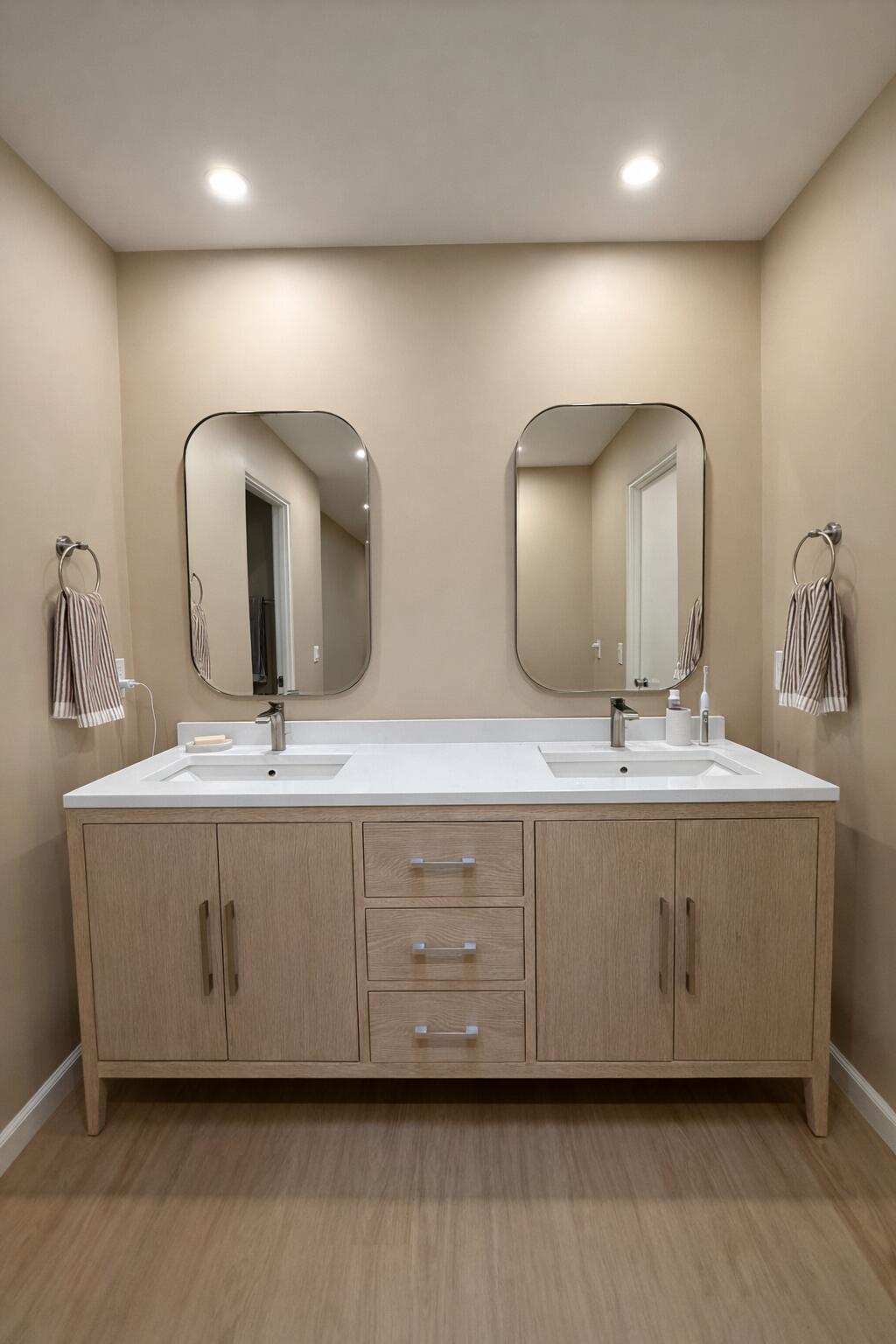 45565 Pima Road Indian Wells, CA 92210 - Photo 21 of 30 a bathroom with double vanity sinks and a mirror