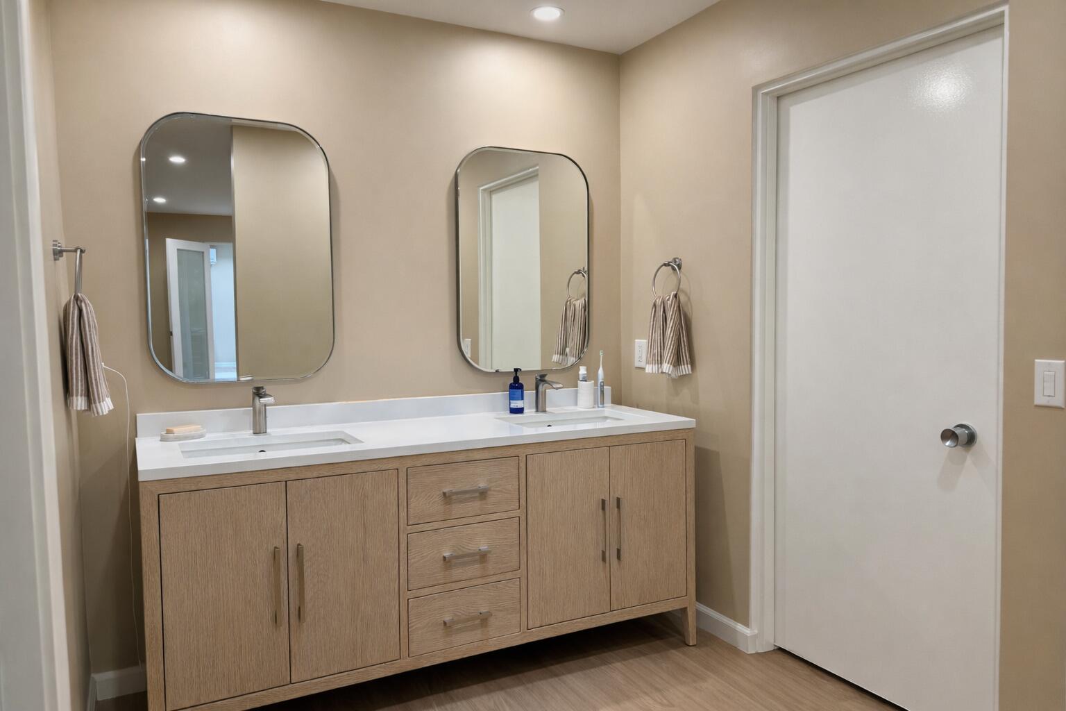 45565 Pima Road Indian Wells, CA 92210 - Photo 22 of 30 a bathroom with double vanity sinks and a mirror