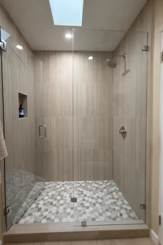 a bedroom with a bed and a lamp