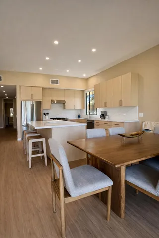 a kitchen with a table and chairs in it