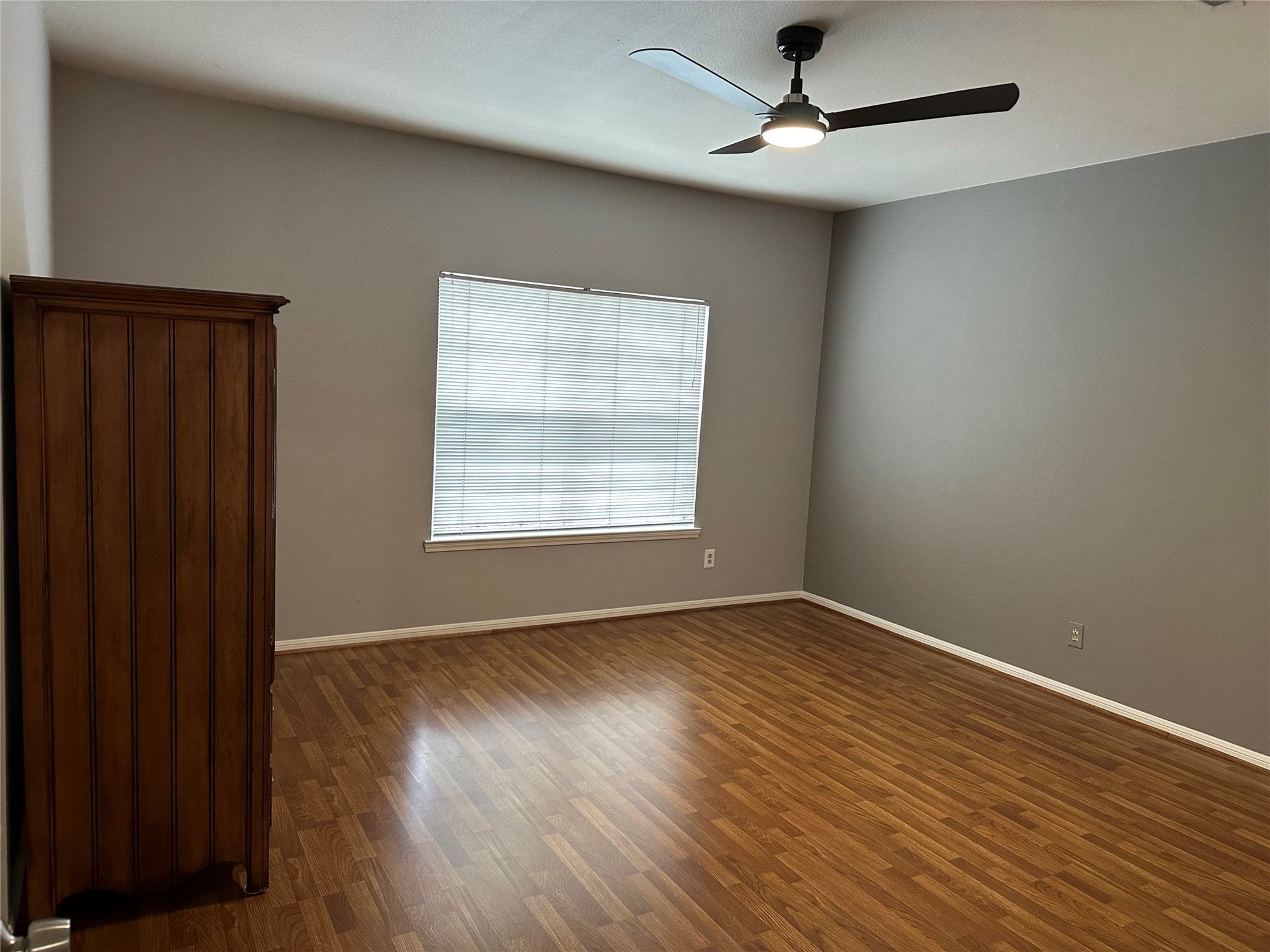 3800 Tanglewilde Street, Unit 504 Houston, TX 77063 - Photo 11 of 20 wooden floor in an empty room with a window