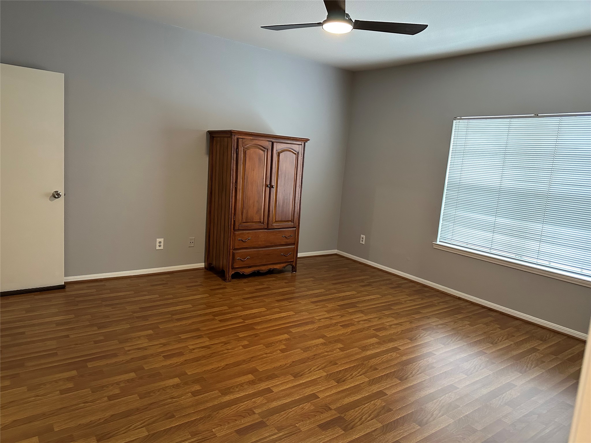 3800 Tanglewilde Street, Unit 504 Houston, TX 77063 - Photo 12 of 20 wooden floor in an empty room with a window
