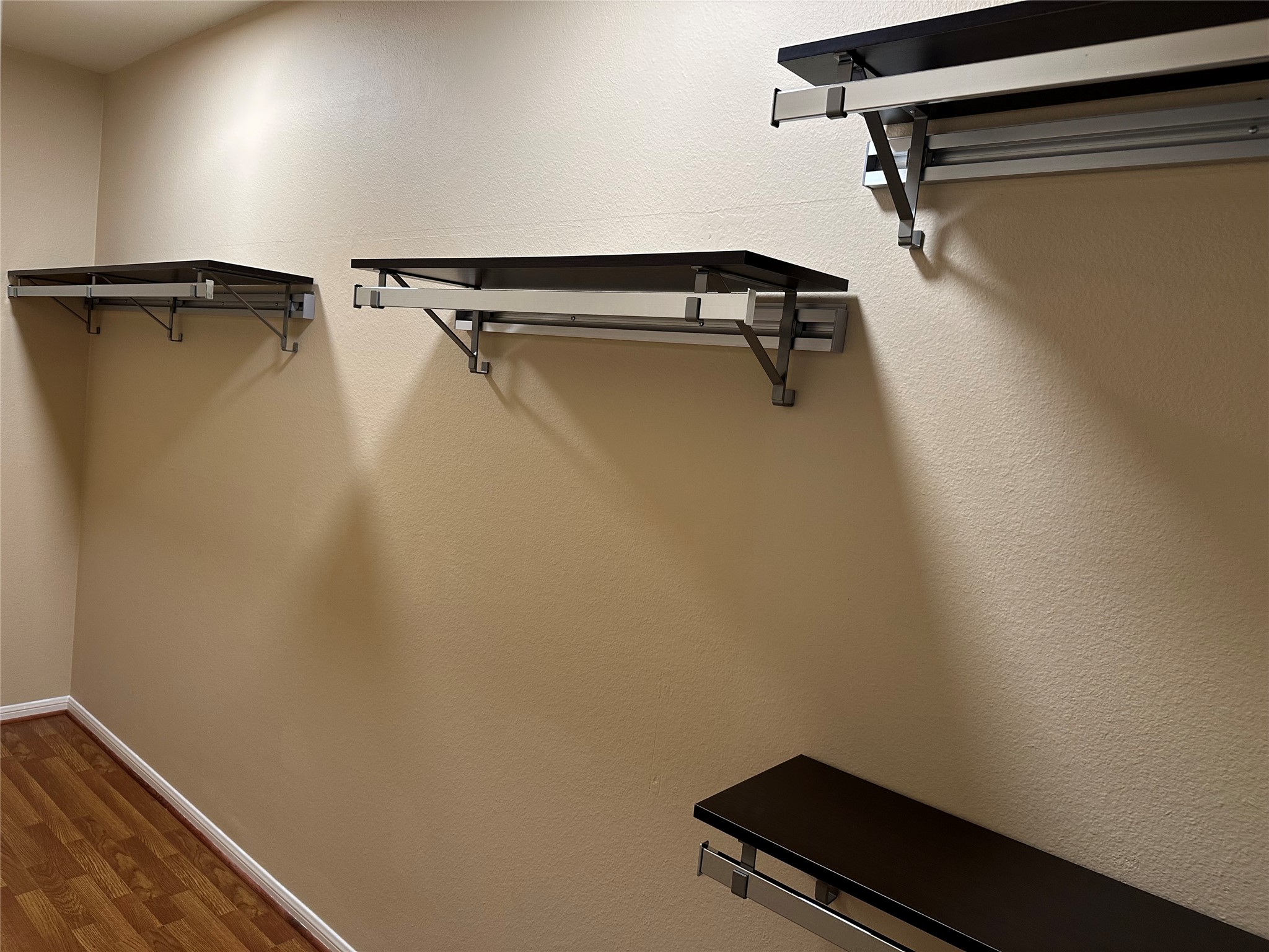 3800 Tanglewilde Street, Unit 504 Houston, TX 77063 - Photo 13 of 20 a view of a room with racks on the wall