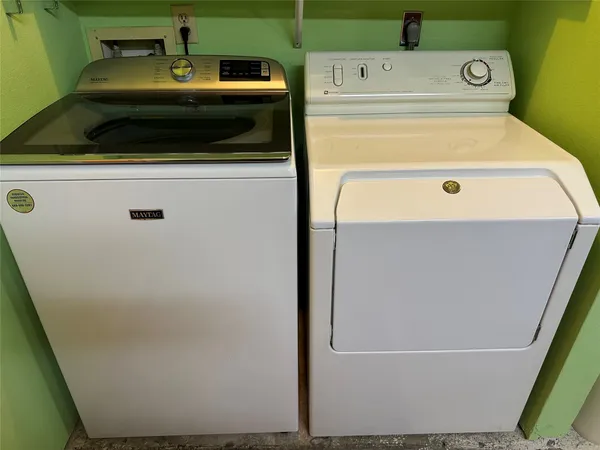 a utility room with dryer and washer