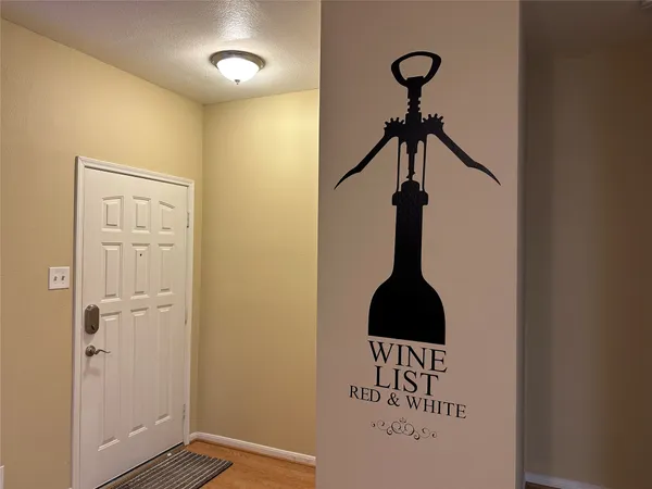 a view of a hallway with a table and a potted plant