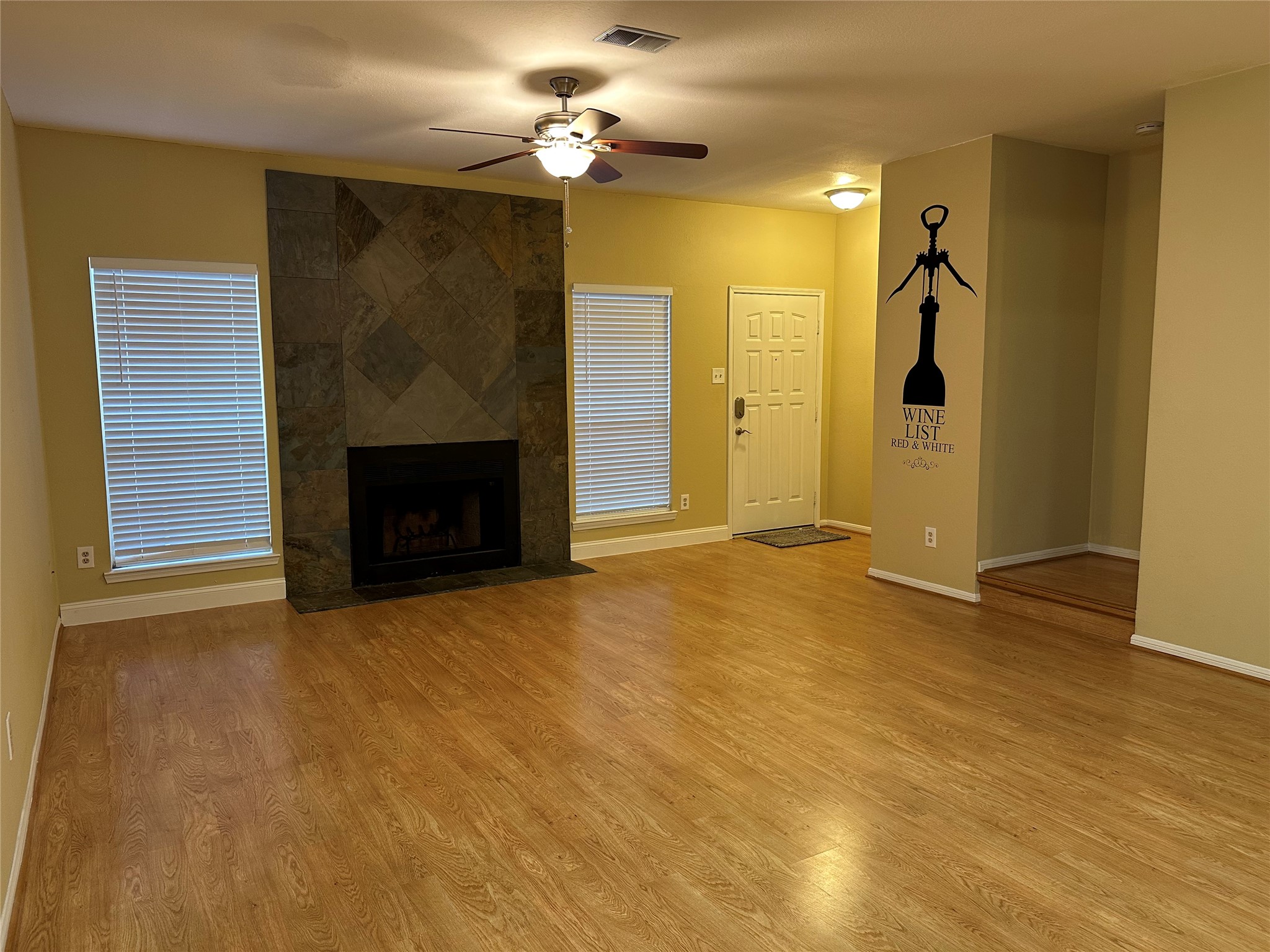 3800 Tanglewilde Street, Unit 504 Houston, TX 77063 - Photo 4 of 20 a view of empty room with a fireplace and fan