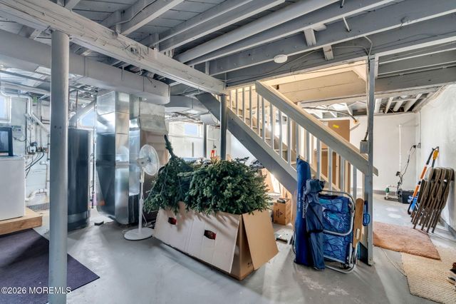 a view of entryway with a tub and stairs