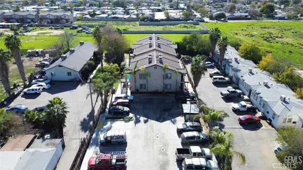 an aerial view of a house with yard swimming pool and outdoor seating