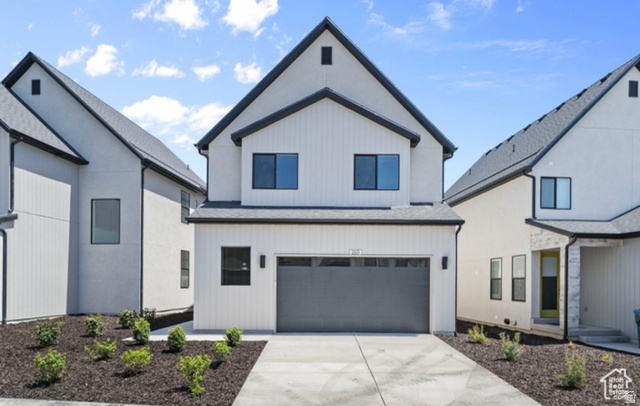 2415 North Ribe Lane Lehi, UT 84048 - Photo 4 of 17 Modern farmhouse with an attached garage, concrete driveway, and a shingled roof